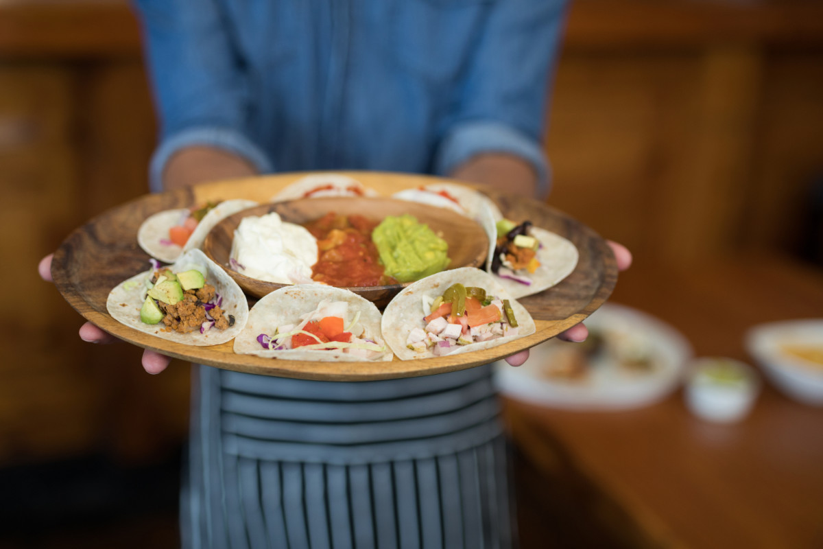 Waiter mesero with plate in mexico
